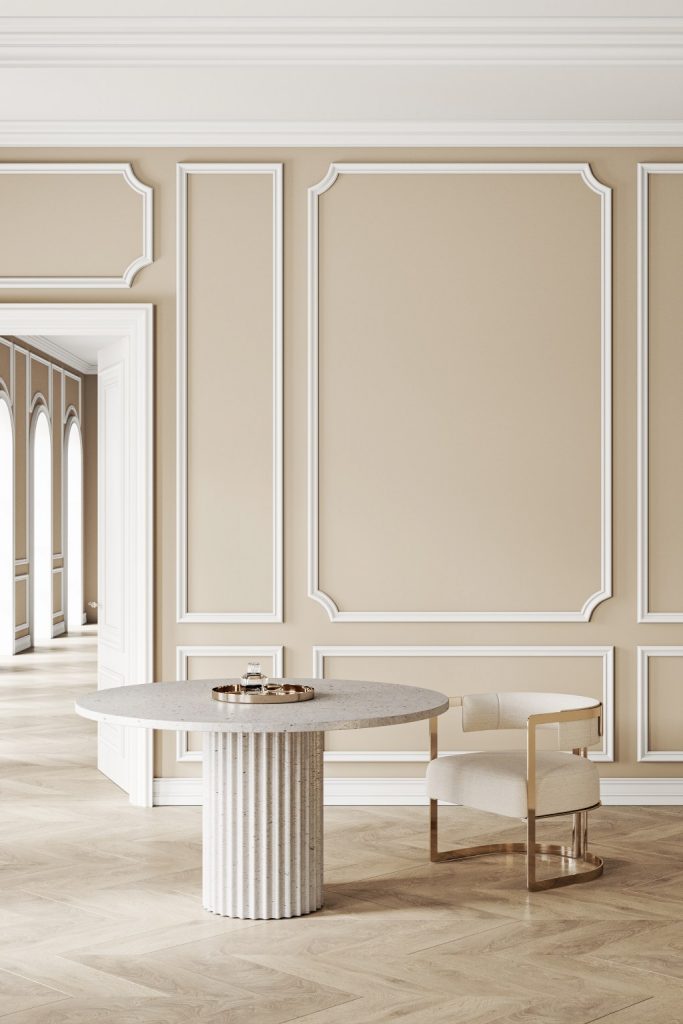 Classical Neoclassic Interior with Beige Wall Molding Terrazzo Fluted Table and Gold Accent Chair.jpg