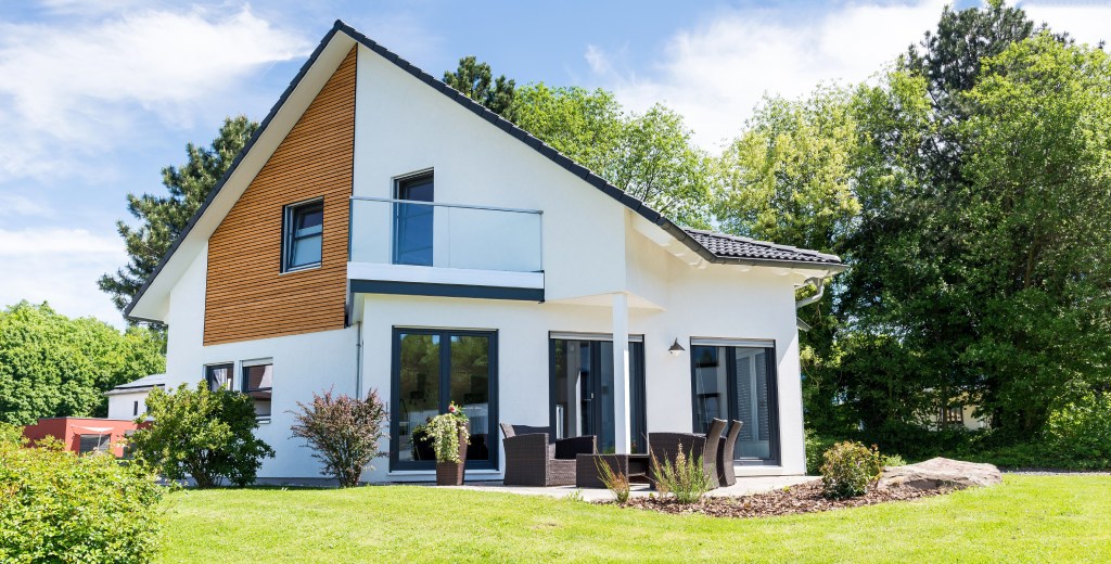 Two Story Modern Home with Brick and Siding Facade Side Entrance and Well Kept Lawn.jpg